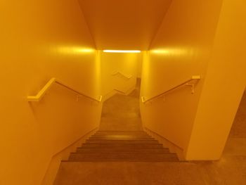 Staircase in illuminated corridor