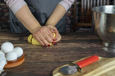 Women preparing delicious apple tart or pie  ..knead the dough.