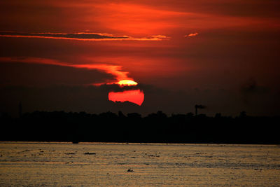 Scenic view of dramatic sky during sunset