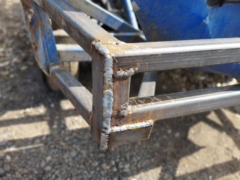 High angle view of rusty abandoned bench