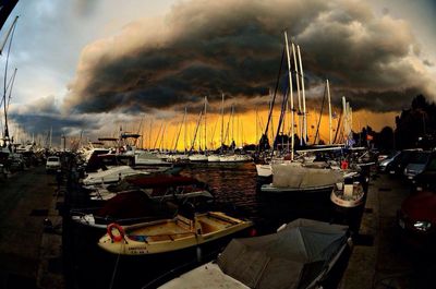 Boats moored at harbor