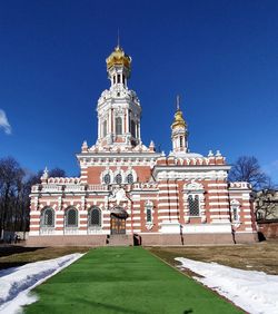 Low angle view of historic building against clear blue sky