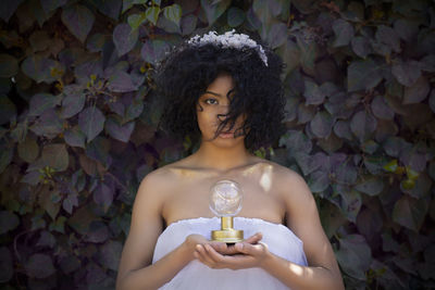 Portrait of young woman with a light