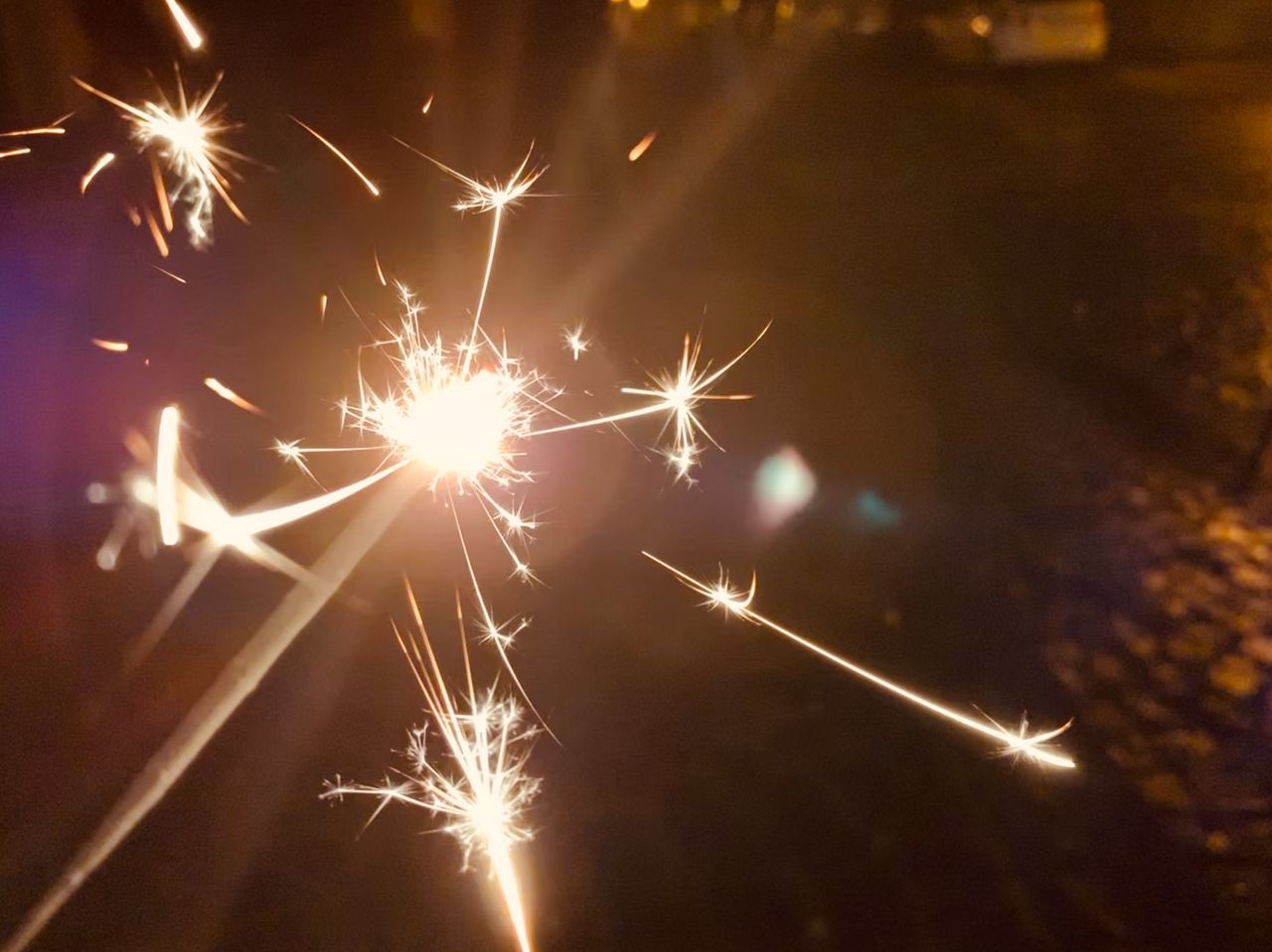CLOSE-UP OF FIREWORKS IN NIGHT SKY