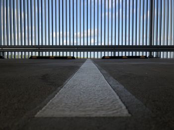 Surface level of bridge against sky in city