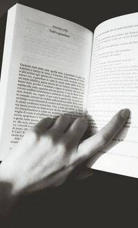 Close-up of hand holding book