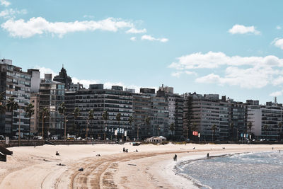 Buildings in city against sky