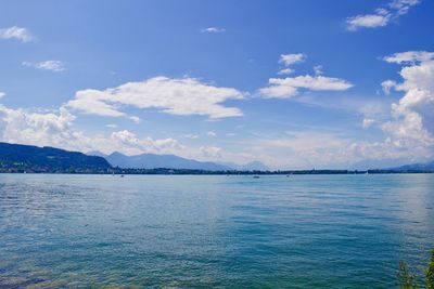 Scenic view of sea against blue sky