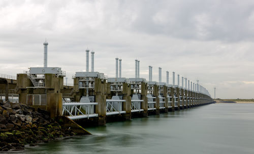 Pier over sea against sky