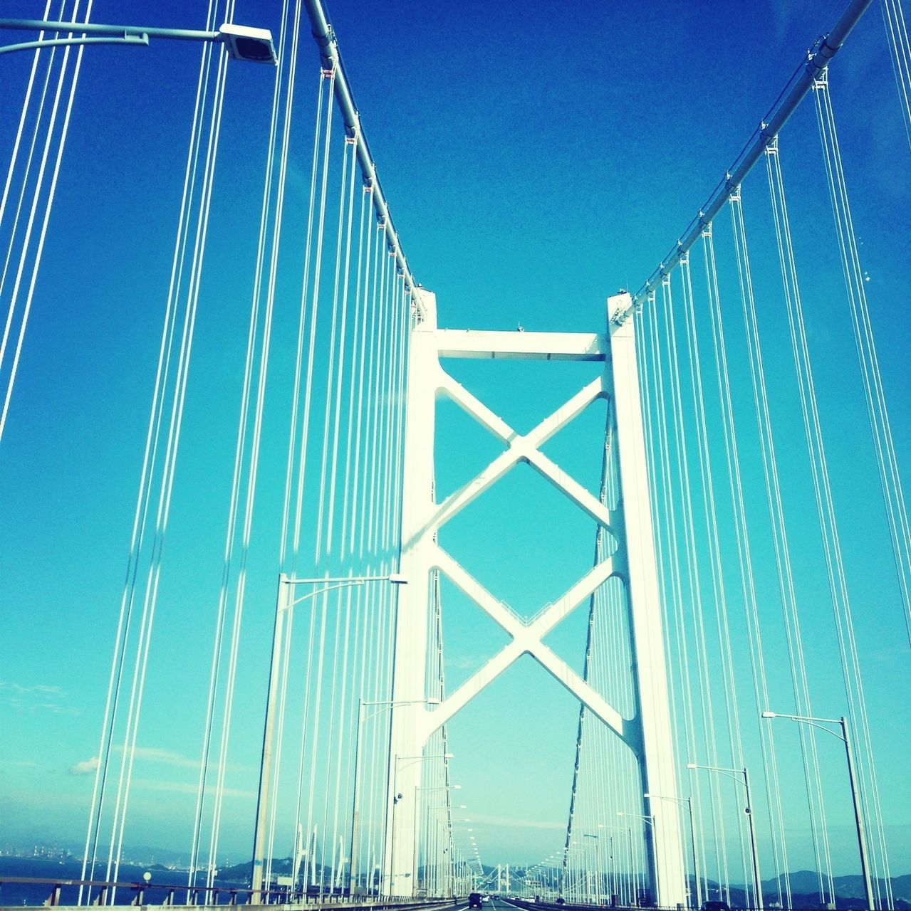 blue, connection, built structure, suspension bridge, clear sky, engineering, architecture, low angle view, bridge - man made structure, bridge, cable-stayed bridge, copy space, sky, transportation, outdoors, metal, no people, day, support, long