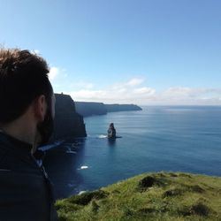 Man in sea against clear sky