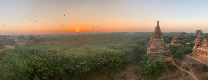 Panoramic view of temple against sky during sunset