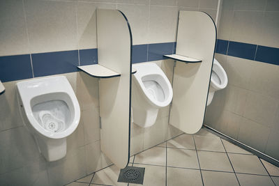 High angle view of urinals in public restroom