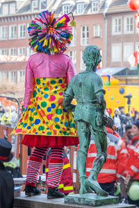 People in front of multi colored building