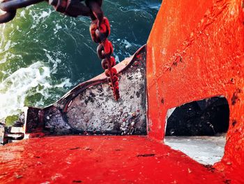 Man standing on rock by sea