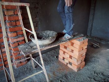 Low section of man working at construction site