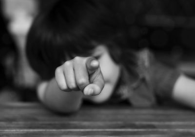 Close-up portrait of boy on table