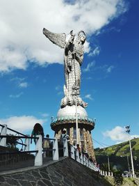 Low angle view of loma el panecillo statue against sky