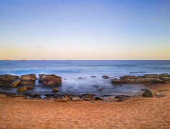 Scenic view of sea against clear sky