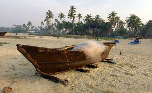 Fishing net in boat moored at beach