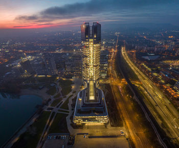 Hungary - budapest landscape with the amazing highest skyscraper, mol hq, from drone view at night