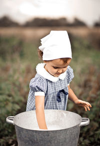 Portrait of boy standing in yard