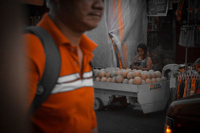 People working at market stall