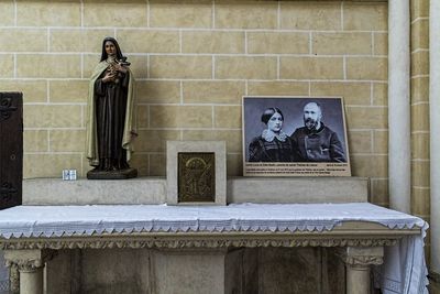 Low angle view of statue against wall