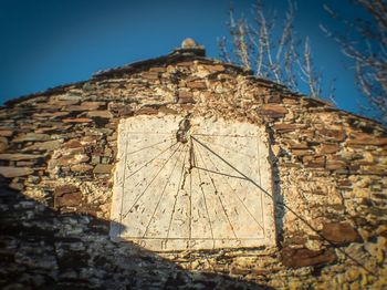 Low angle view of built structure against blue sky