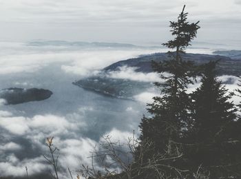 Scenic view of mountains against cloudy sky