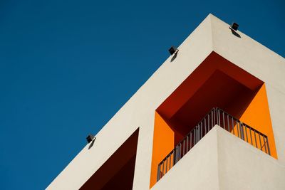 Low angle view of a building against clear blue sky