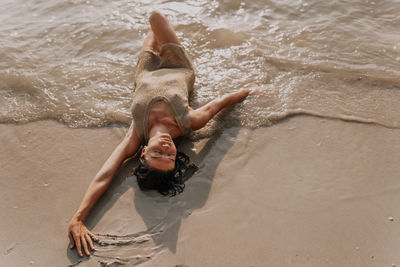 Low section of woman in water