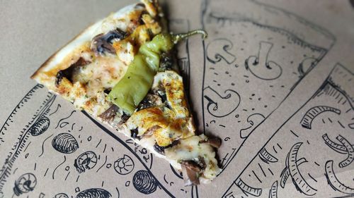 High angle view of pizza served in plate