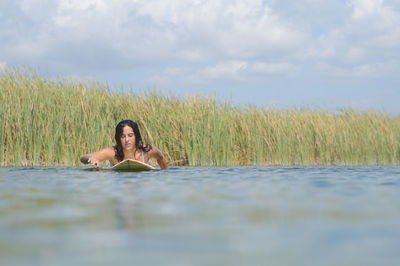 Portrait of young woman relaxing on land