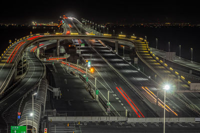 High angle view of light trails on road at night