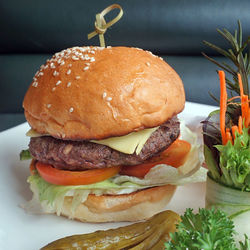 Close-up of hamburger with vegetables served in plate