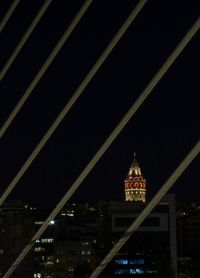 Low angle view of illuminated building at night