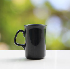 Close-up of coffee cup on table