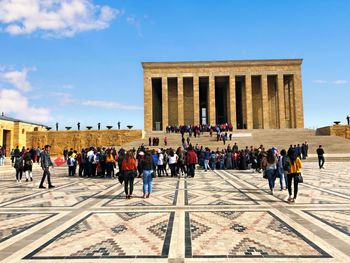 Group of people in front of historical building