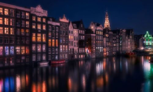 Reflection of buildings in city at night