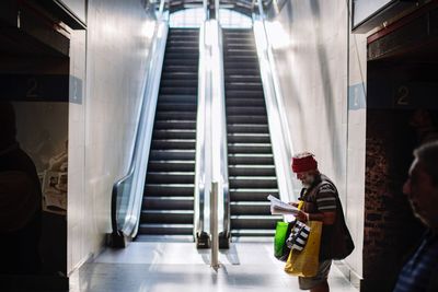 People standing on escalator