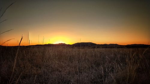 Scenic view of landscape against sky during sunset