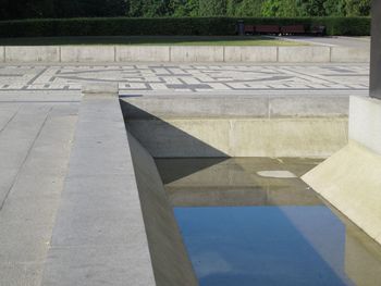 Shadow of people on footpath