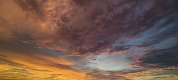 Low angle view of dramatic sky during sunset