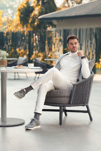 Portrait of woman sitting on chair