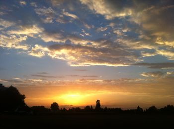 Scenic view of silhouette landscape against sky during sunset