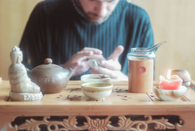 Midsection of man on table