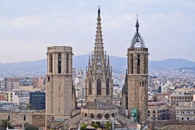 View of buildings in city against sky