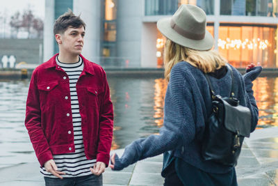 Young couple quarreling in city