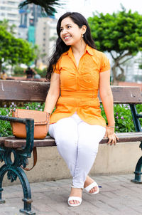 Portrait of smiling young woman outdoors